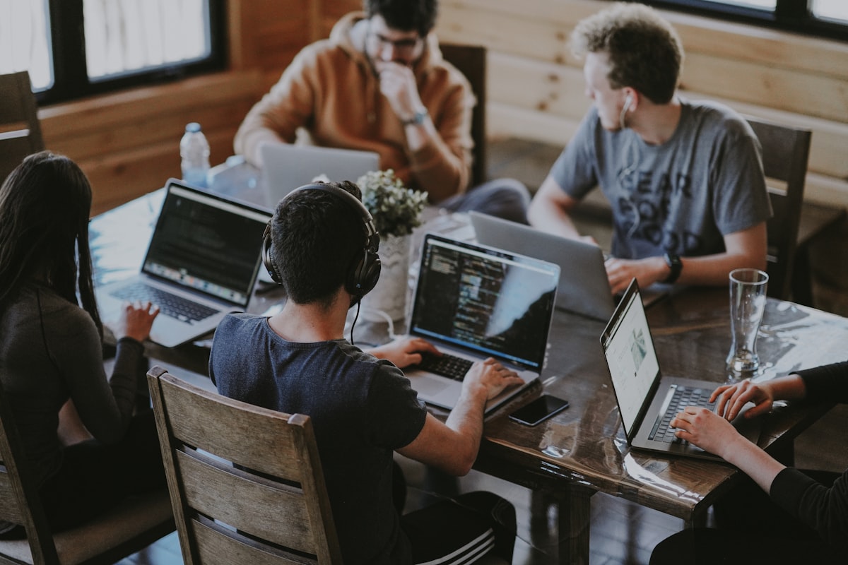 ProvenPeak software development team collaborating and working together in a modern office environment
